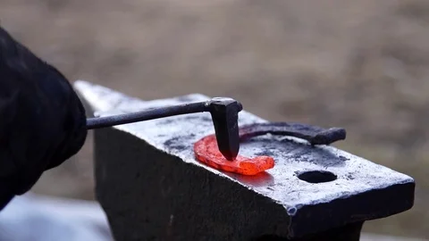 Forging horseshoe in slow motion Stock Footage 77010666