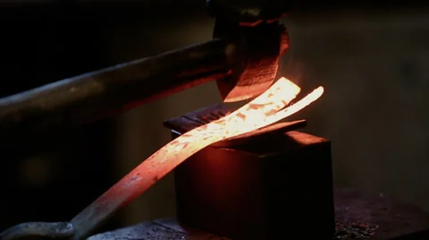 Forging hot metal in the forge Stock Footage 67696373