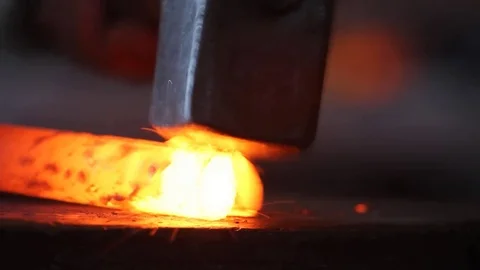 Forging hot metal in smith with hand hummer Stock Footage 71037875