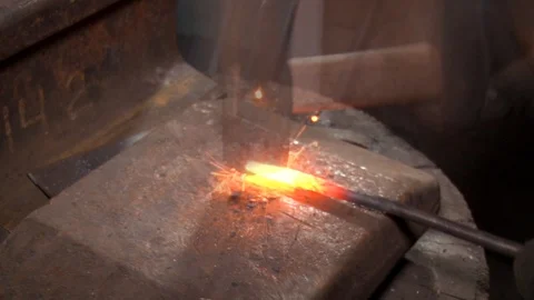 Forging iron in the process. Work with metal. Closeup view of iron production. Stock Footage 118245421