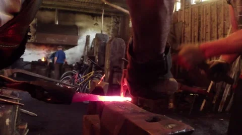 Forging metal on an anvil, arms smiths Stock Footage 46464434