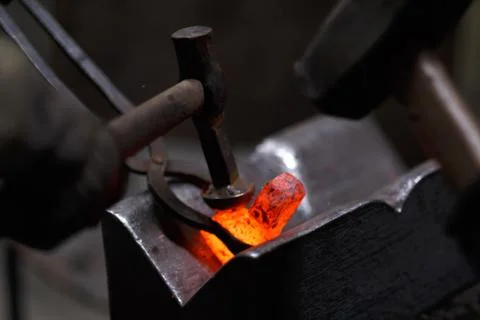 Forging the molten metal, making of an axe Stock Photos