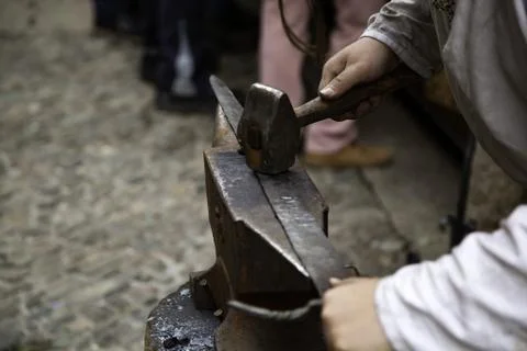 Forging a sword by fire, artisan worker, preparation and manufacturing Stock Photos