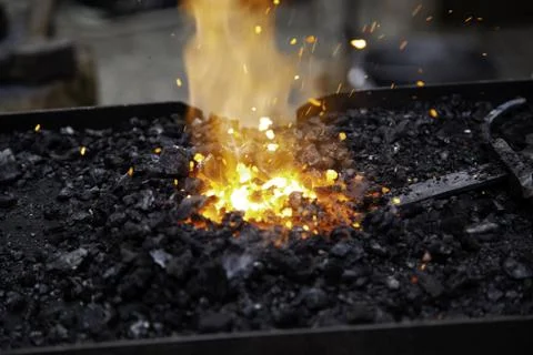 Forging a sword by fire, artisan worker, preparation and manufacturing Stock Photos