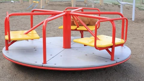 Forgotten Brown Teddy Bear on a Rotating Childrens Carousel Stock Footage 154046218