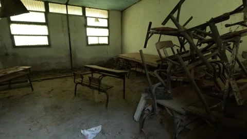 A forgotten school classroom shows the lasting effects of school dropout and Stock Footage 345655339