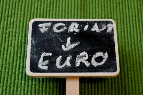 Forint to euro change written on chalkboard currency conversion concept Photos