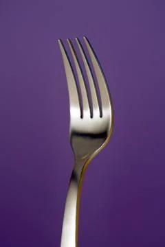 A fork against red background Stock-Fotos