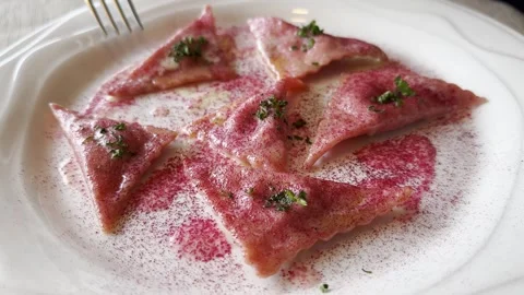 Fork and Beetroot Ravioli on a White Plate Stock Footage 267952103