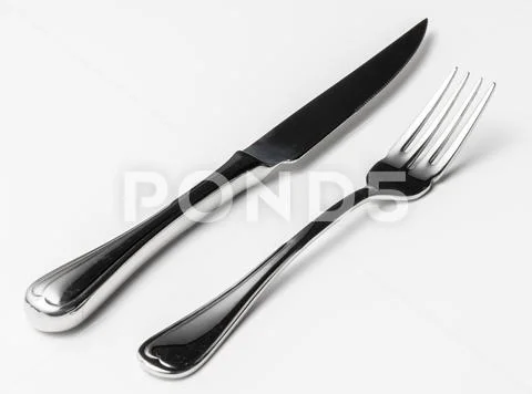 Fork and knife isolated on white background Stock-Fotos