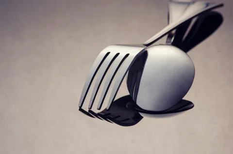 Fork and silver spoon on dark background Foto stock