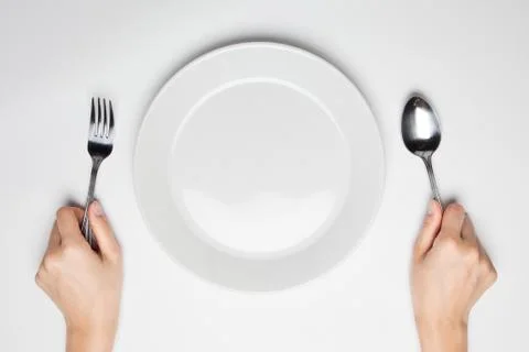 Fork and spoon and empty plate Stock Photos