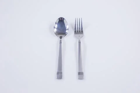 Fork and spoon hand  on white background Stock Photos