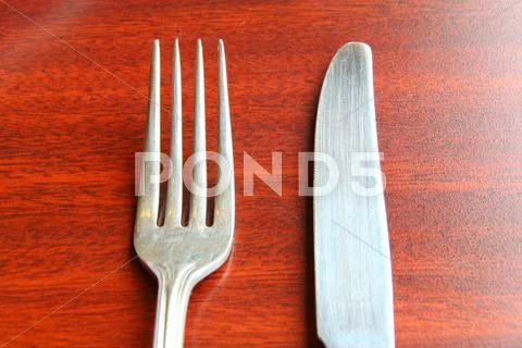Fork And Spoon Isolated On Dining Table