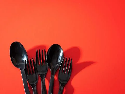 Fork and spoon on red Stock Photos