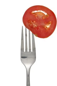 Fork and tomato Stock Photos