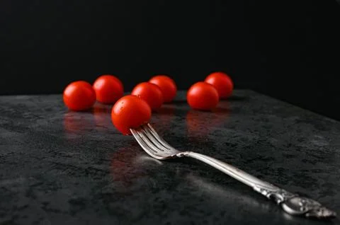Fork and tomatoes on a flat lay Foto stock