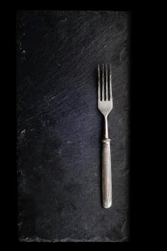 Fork on a black slate 스톡 사진