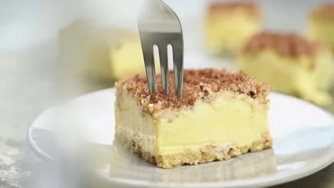Fork breaks off a piece of tiramisu ice cream sandwich. Stock Footage 169798623