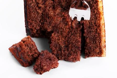 A fork in a broken chocolate cake Stock Photos