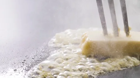 Fork with butter on a pan Stock Footage 85075600