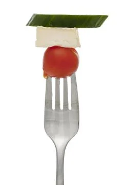 Fork with cherry tomato cheese and cucumber Stock Photos