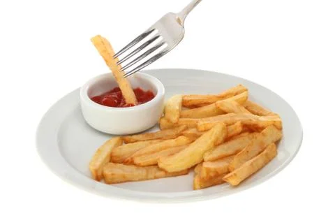 Fork chips and ketchup Stock Photos