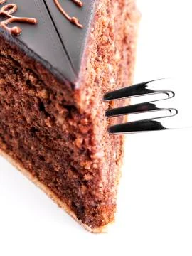 A fork in a chocolate cake Stock Photos