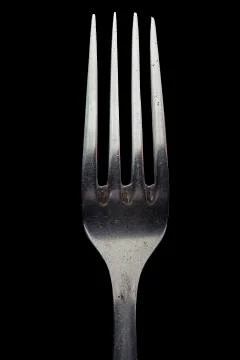 Fork close up. Isolated image on a black background. Stock Photos
