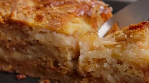 Fork cuts off a piece of delicate dry dough pie Stock Footage 328093580