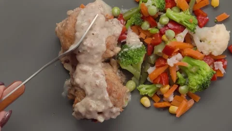 A fork cuts a piece of tender meatball Stock-Footage 303424139
