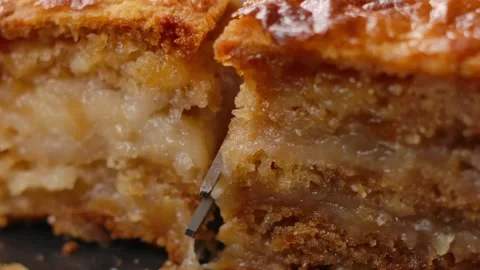 Fork cutting a slice of homemade apple pie. Close-up Stock Footage 314890076