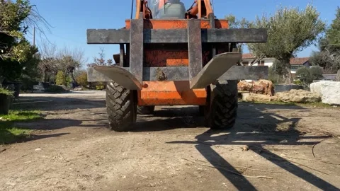 Fork detail of forklift working in construction site or farm Stock-Footage 173178138