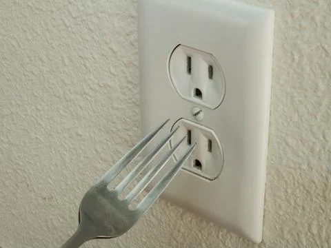 Fork doesn't go in the outlet Stockfoto's