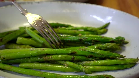 Fork eating grill vegetable asparagus salt pepper vegan vegetarian healthy me Stock Footage 296031283