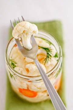 Fork with fermented cauliflower on jar Stock-Fotos