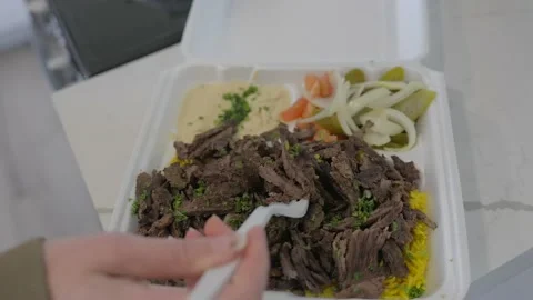 Fork grabbing shawarma from plate Stock Footage 235857946