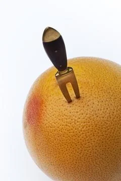 Fork in a grapefruit 写真素材