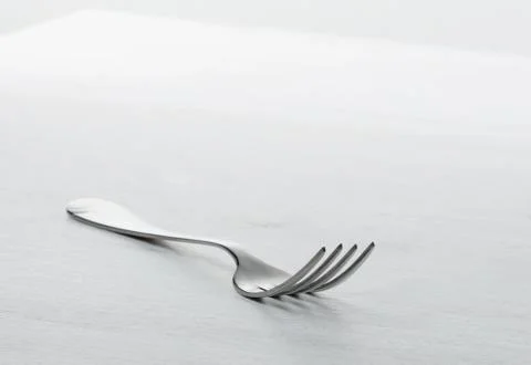 Fork on grey table Stock Photos