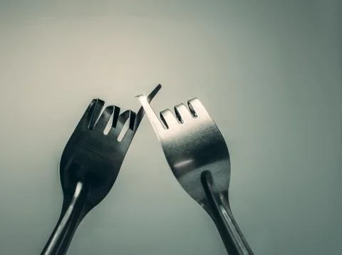 Fork hook each other promise, peace, friendship background concept. Stock Photos