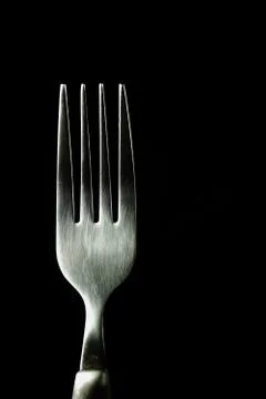 Fork isolated on black background Stock Photos