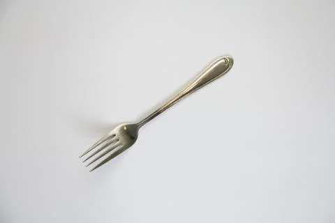 Fork isolated on gray background. Stock Photos