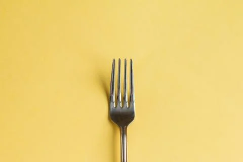 Fork isolated on yellow Stock Photos