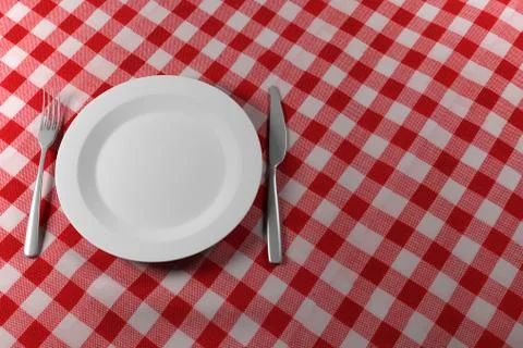 Fork Knife and Plate on a red table cloth Ilustração Stock