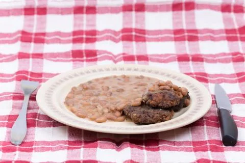 Fork knife meatball cooked beans served plate Stock Photos