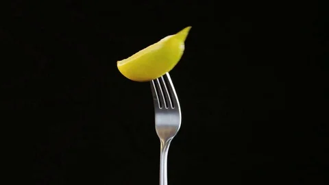 Fork With Lemon on Black Background Stock Footage 70534565