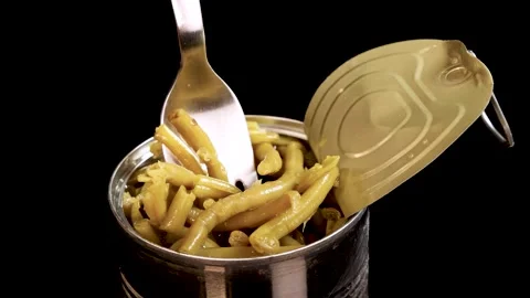 Fork Lifting Haricot Beans from Open Canned Food Stock Footage 313925782