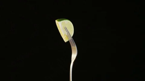 Fork With Lime on Black Background Stock Footage 70534825