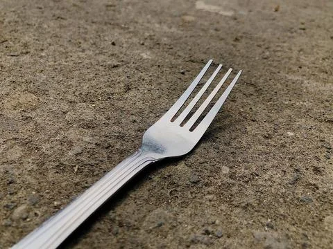 A fork located in the front yard of the house Stock Photos