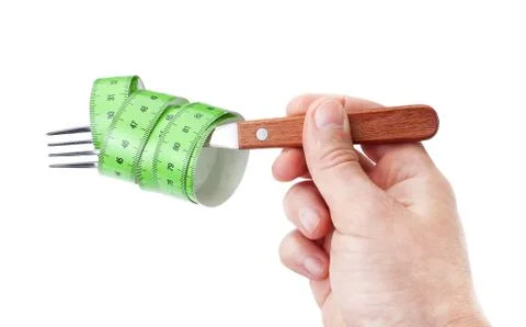 Fork with measuring meter in his hand, a symbol of the diet. Stock Photos